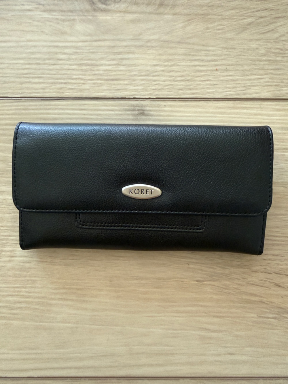 Koret Black Leather Long Flap Wallet with Branded Metal Accent